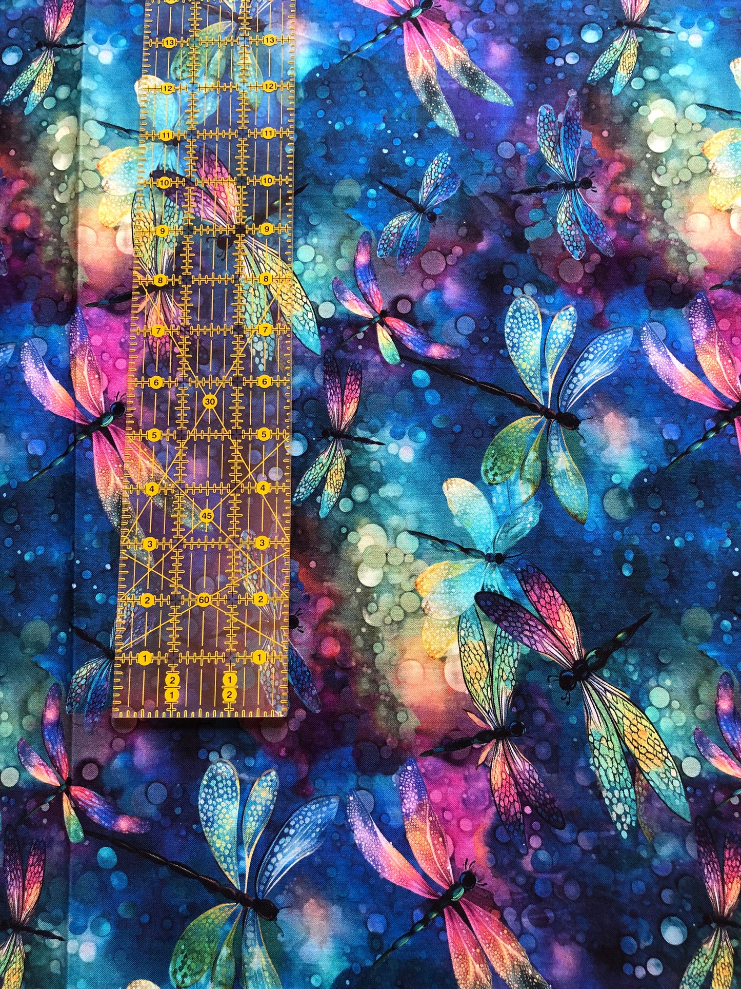 Rainbow Dragonflies on Blue Fabric