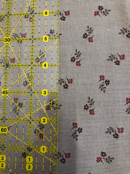 Jo Morton fabric, red and navy flower sprigs on pale blue fine stripe, beside a ruler in inches