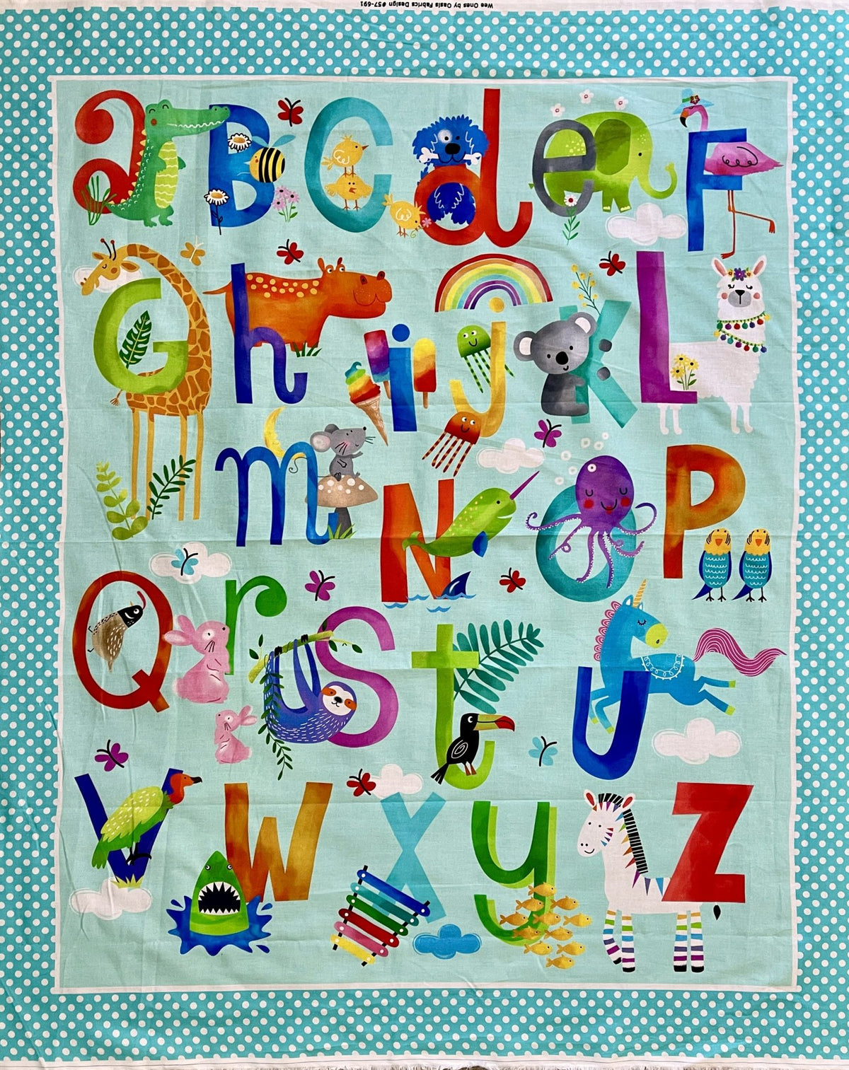 The Alphabet Cot Panel: letters a to z with animals on an aqua background