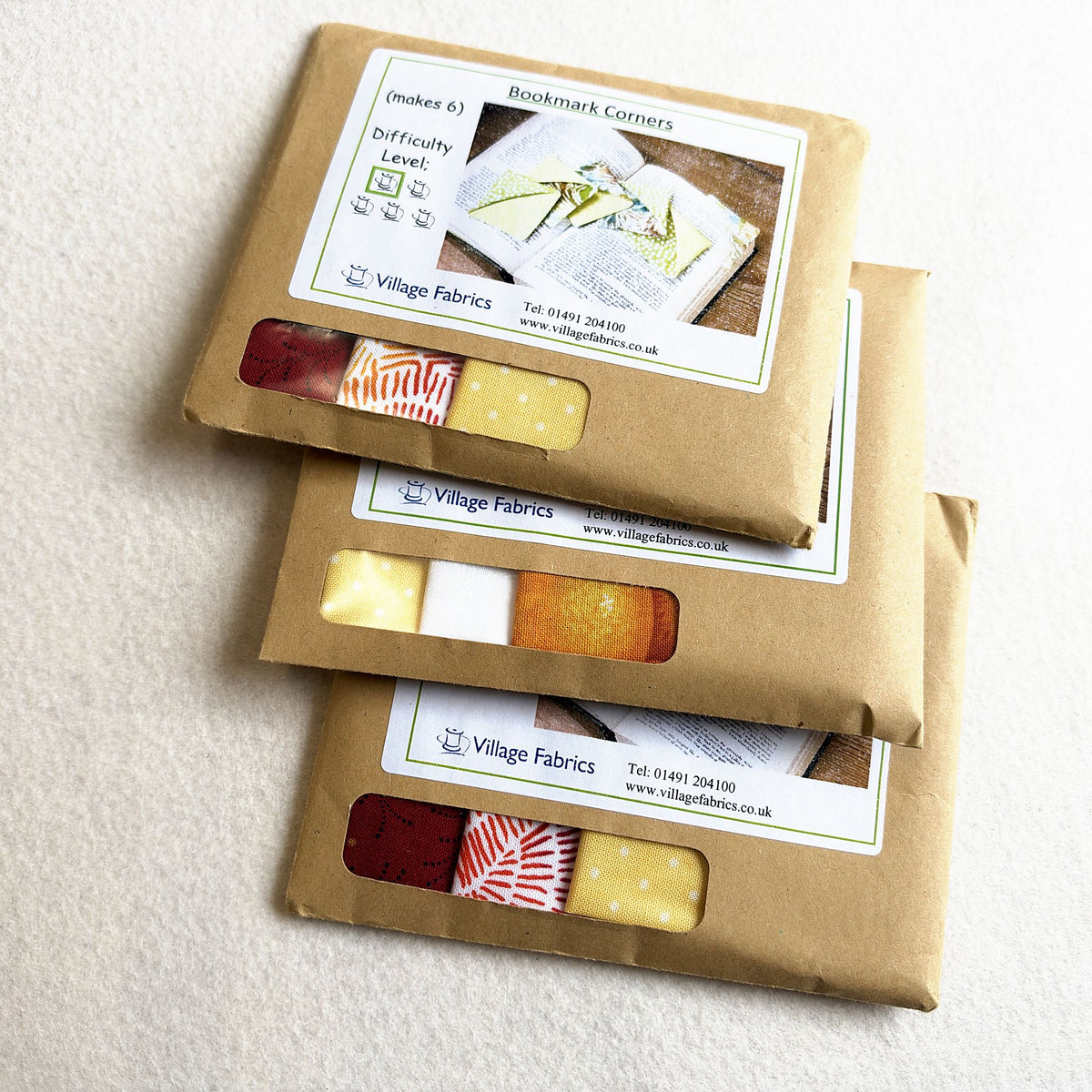 Bookmark Corners kits in Bright: red, orange and yellow fabrics