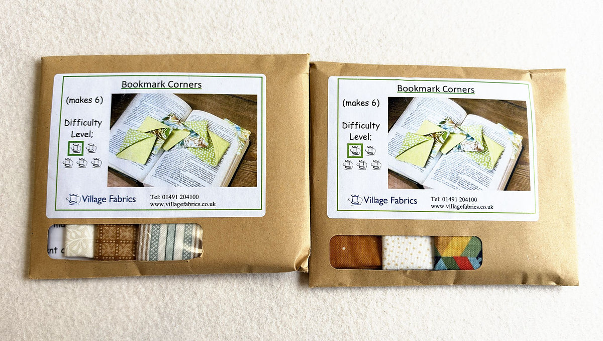 Two Bookmark Corners kits in Neutral, showing how the fabrics vary: creams, browns and a grey stripe in one, mustard, cream and a geometric print in the other