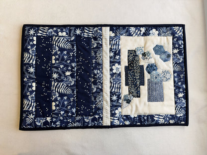 The whole outside of the Boro Folder Cover opened flat: the back with navy strips, the stitched spine and the boro front