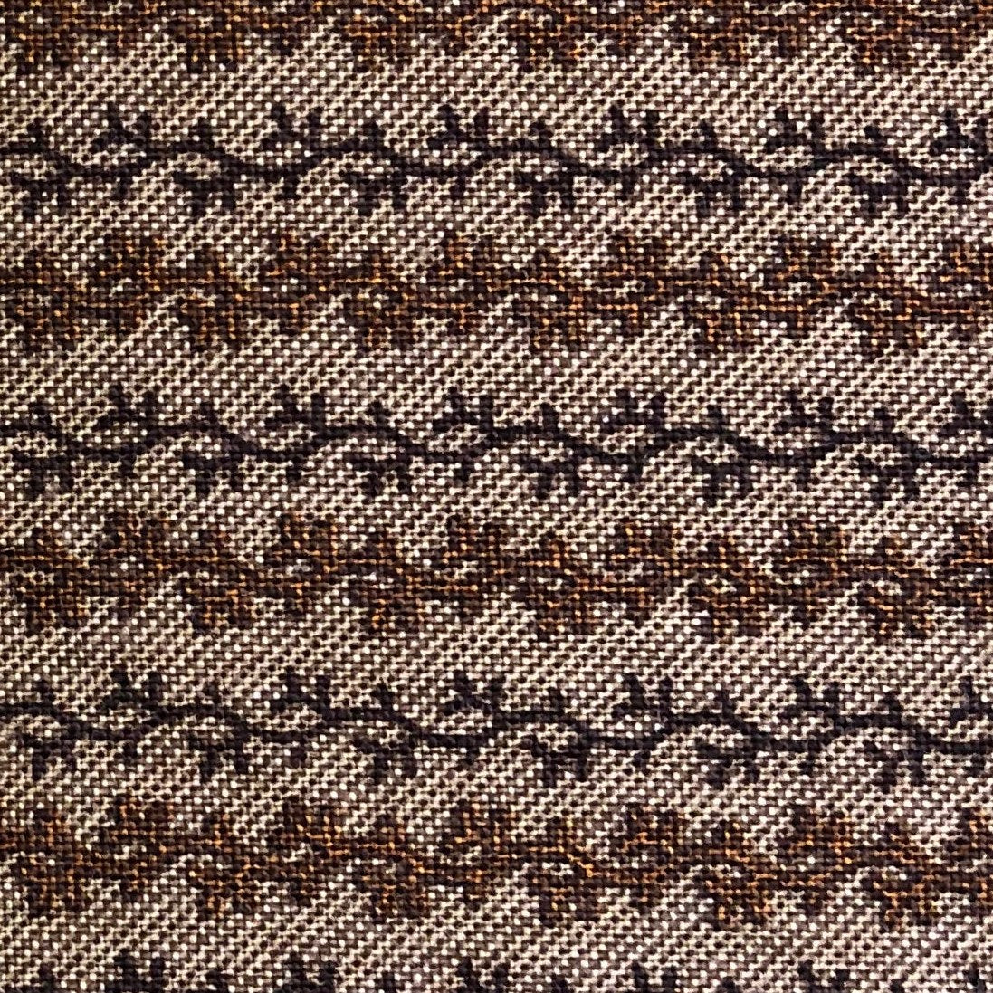 Jo Morton fabric, rows of small brown leafy vines on a pale ground