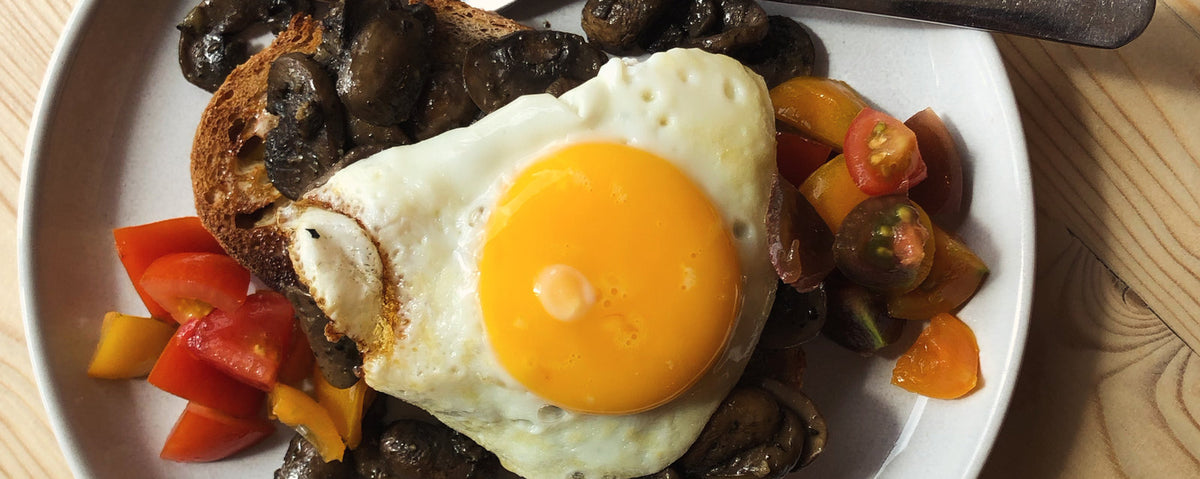 A breakfast at The Pantry at Rush Farm, with a fried egg and tomatoes